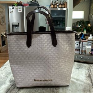 light pink, Dooney and Bourke has attached wallet, keychain adjustable strap